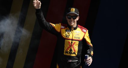 KANSAS CITY, KANSAS - SEPTEMBER 28: Connor Zilisch, driver of the #88 KOA/RTIC Chevrolet, waves to fans as he walks onstage during driver intros prior to  the NASCAR Xfinity Series Kansas Lottery 300 at Kansas Speedway on September 28, 2024 in Kansas City, Kansas. (Photo by Sean Gardner/Getty Images) | Getty Images