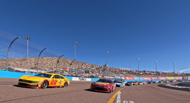 AVONDALE, ARIZONA - NOVEMBER 10: Joey Logano, driver of the #22 Shell Pennzoil Ford, and Martin Truex Jr., driver of the #19 Bass Pro Shops Toyota, lead the field on a pace lap prior to the NASCAR Cup Series Championship Race at Phoenix Raceway on November 10, 2024 in Avondale, Arizona. (Photo by Chris Graythen/Getty Images) | Getty Images
