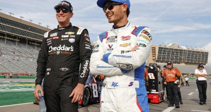 HAMPTON, GEORGIA - JULY 08: Kyle Busch, driver of the #8 Cheddar's Scratch Kitchen Chevrolet, (L) and Kyle Larson, driver of the #5 HendrickCars.com Chevrolet, talk on the grid during qualifying for the NASCAR Cup Series Quaker State 400 Available at Walmart at Atlanta Motor Speedway on July 08, 2023 in Hampton, Georgia. (Photo by Alex Slitz/Getty Images) | Getty Images