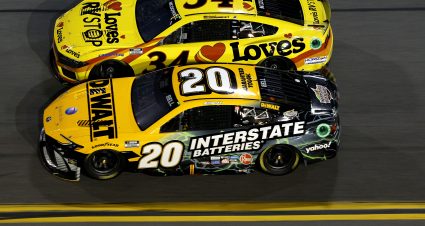 DAYTONA BEACH, FLORIDA - FEBRUARY 15: Christopher Bell, driver of the #20 DEWALT/Interstate Batteries Toyota, and Michael McDowell, driver of the #34 Love's Travel Stops Ford, race during the NASCAR Cup Series Bluegreen Vacations Duel #2 at Daytona International Speedway on February 15, 2024 in Daytona Beach, Florida. (Photo by Sean Gardner/Getty Images) | Getty Images