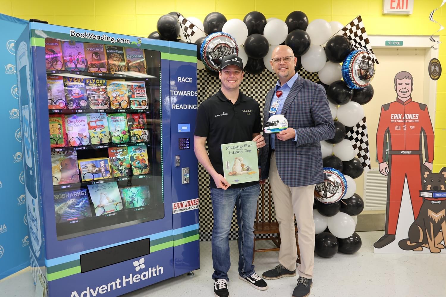 Erik Jones reads to children and delivers a 'Bookworm' vending machine ...