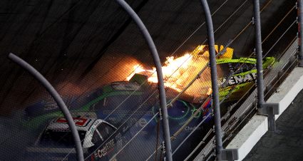 DAYTONA BEACH, FLORIDA - FEBRUARY 15: Ryan Blaney, driver of the #12 Menards/PEAK Ford, in flames after an on-track incident  with Kyle Busch, driver of the #8 Zone Chevrolet, and Brad Keselowski, driver of the #6 Castrol Edge Ford, during the NASCAR Cup Series Bluegreen Vacations Duel #2 at Daytona International Speedway on February 15, 2024 in Daytona Beach, Florida. (Photo by Jared C. Tilton/Getty Images) | Getty Images