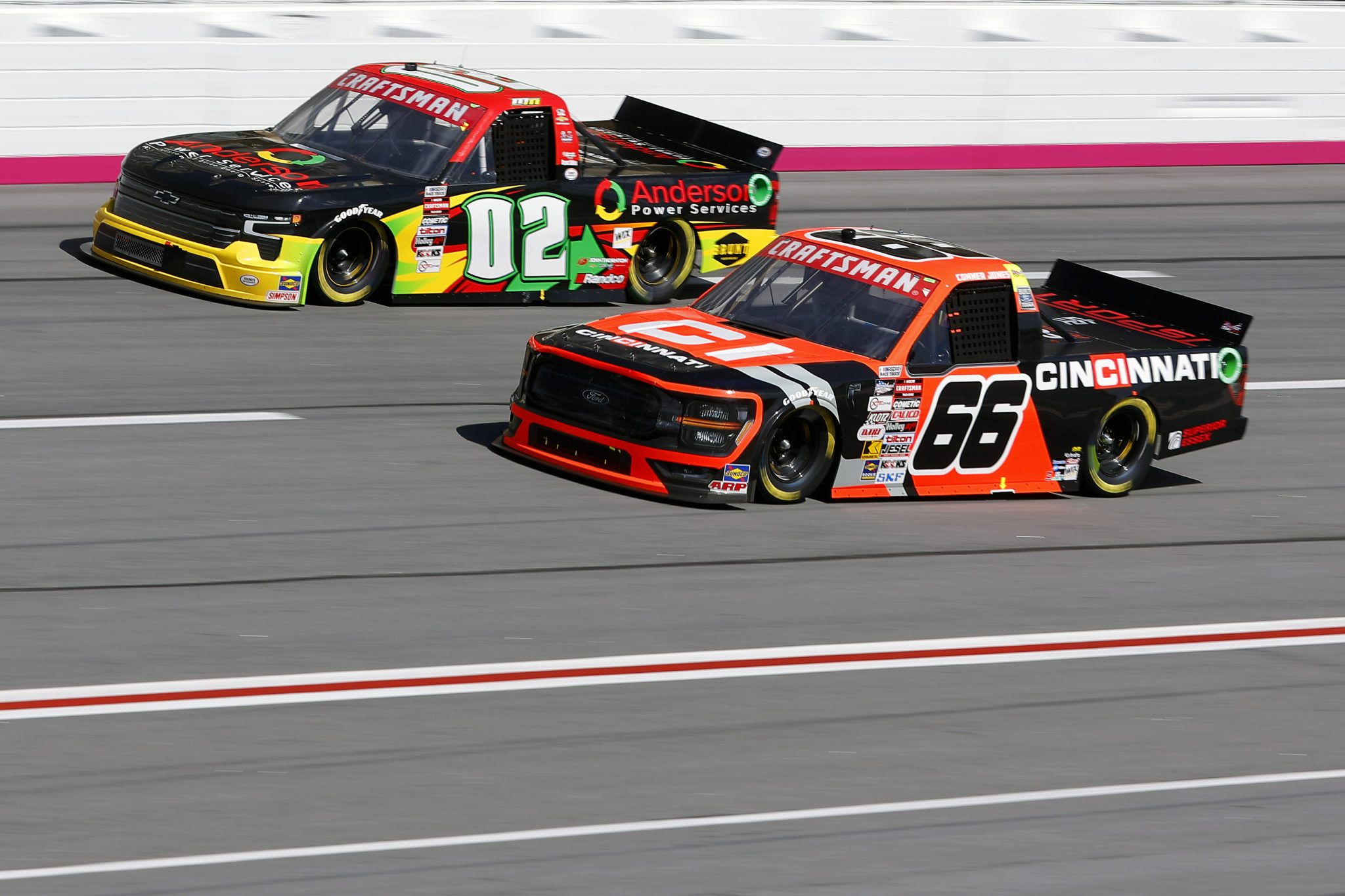 HAMPTON, GEORGIA - FEBRUARY 24: Mason Massey, driver of the #02 Anderson Power Services Chevrolet, and Conner Jones, driver of the #66 Cincinnati Ford, race during the NASCAR Craftsman Truck Series Fr8 208 at Atlanta Motor Speedway on February 24, 2024 in Hampton, Georgia. (Photo by Todd Kirkland/Getty Images) | Getty Images
