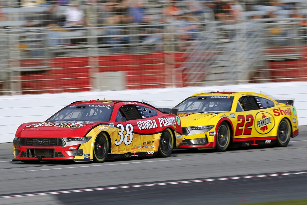 HAMPTON, GEORGIA - FEBRUARY 25: Todd Gilliland, driver of the #38 Georgia Peanuts Ford, leads Joey Logano, driver of the #22 Shell Pennzoil Ford, during the NASCAR Cup Series Ambetter Health 400 at Atlanta Motor Speedway on February 25, 2024 in Hampton, Georgia. (Photo by Todd Kirkland/Getty Images) | Getty Images