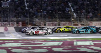 HAMPTON, GEORGIA - FEBRUARY 25: Daniel Suarez, driver of the #99 Freeway Insurance Chevrolet, crosses the finish line ahead of Kyle Busch, driver of the #8 Cheddar's Scratch Kitchen Chevrolet, and Ryan Blaney, driver of the #12 BodyArmor Zero Sugar Ford, to win the NASCAR Cup Series Ambetter Health 400 at Atlanta Motor Speedway on February 25, 2024 in Hampton, Georgia. (Photo by Todd Kirkland/Getty Images) | Getty Images