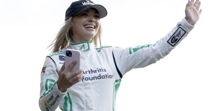DAYTONA BEACH, FLORIDA - AUGUST 25: Natalie Decker, driver of the #53 Wawa Rechargers Ford, waves to fans as she walks onstage during driver intros prior to the NASCAR Xfinity Series Wawa 250 powered by Coca-Cola at Daytona International Speedway on August 25, 2023 in Daytona Beach, Florida. (Photo by James Gilbert/Getty Images) | Getty Images
