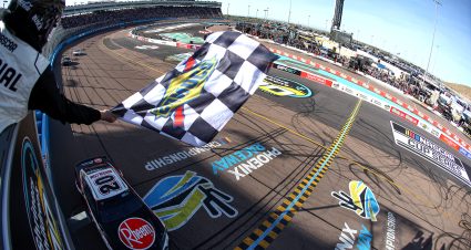 AVONDALE, ARIZONA - MARCH 10: Christopher Bell, driver of the #20 Rheem Toyota, takes the checkered flag to win the NASCAR Cup Series Shriners Children's 500 at Phoenix Raceway on March 10, 2024 in Avondale, Arizona. (Photo by Meg Oliphant/Getty Images) | Getty Images