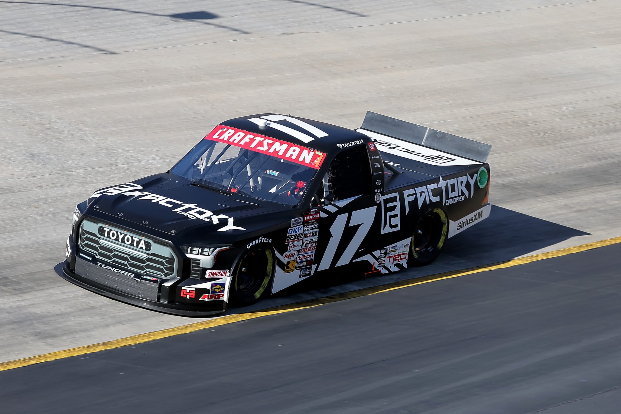 BRISTOL, TENNESSEE - MARCH 16: Taylor Gray, driver of the #17 Factory Canopies Toyota, drives during qualifying for the NASCAR Craftsman Truck Series Weather Guard Truck Race at Bristol Motor Speedway on March 16, 2024 in Bristol, Tennessee. (Photo by Jonathan Bachman/Getty Images) | Getty Images