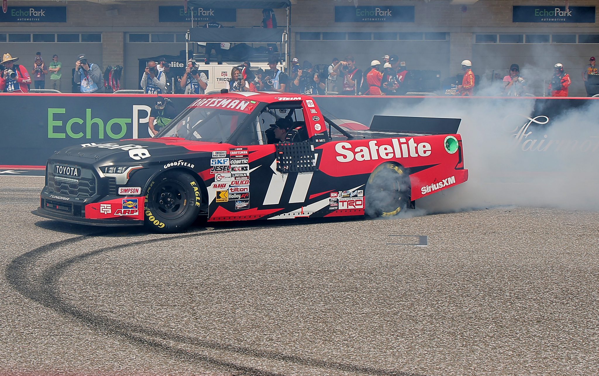 AUSTIN, TEXAS - MARCH 23: Corey Heim, driver of the #11 Safelite Toyota, celebrates with a burnout after winning the NASCAR Craftsman Truck Series XPEL 225 at Circuit of The Americas on March 23, 2024 in Austin, Texas. (Photo by Jonathan Bachman/Getty Images) | Getty Images