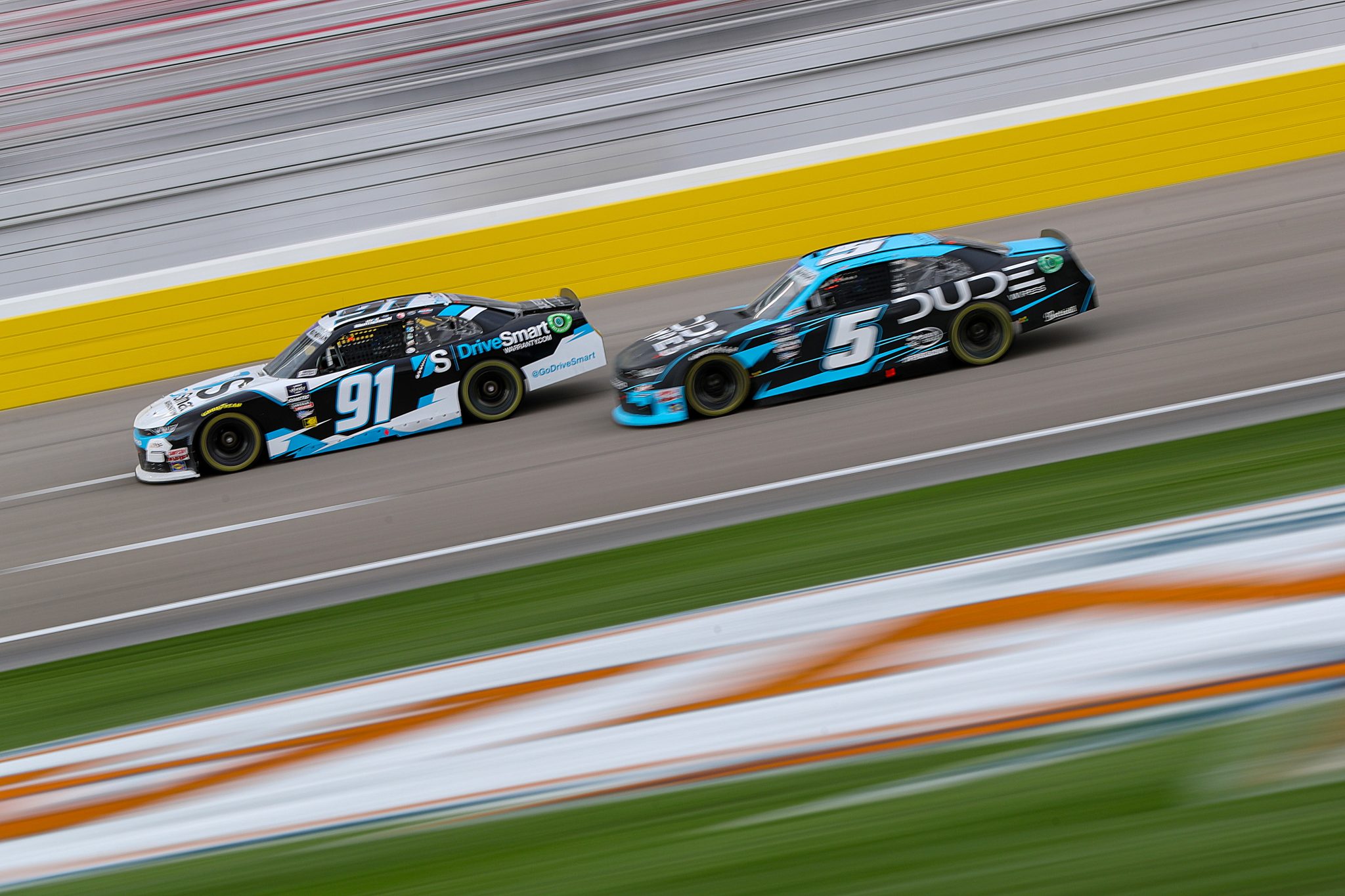 LAS VEGAS, NEVADA - MARCH 02: Kyle Weatherman, driver of the #91 DriveSmartWarranty.com Chevrolet, and Anthony Alfredo, driver of the #5 Dude Wipes Chevrolet, race during the NASCAR Xfinity Series The LiUNA! at Las Vegas Motor Speedway on March 02, 2024 in Las Vegas, Nevada. (Photo by Meg Oliphant/Getty Images) | Getty Images