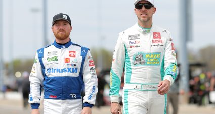 RICHMOND, VIRGINIA - MARCH 30: Denny Hamlin, driver of the #11 Mavis Tires & Brakes Toyota, (L) and Tyler Reddick, driver of the #45 SiriusXM Toyota, walk the grid during qualifying for the NASCAR Cup Series Toyota Owners 400 at Richmond Raceway on March 30, 2024 in Richmond, Virginia. (Photo by Jonathan Bachman/Getty Images) | Getty Images