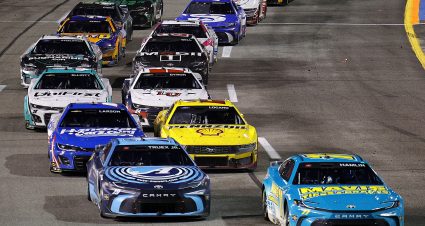 RICHMOND, VIRGINIA - MARCH 31: Denny Hamlin, driver of the #11 Mavis Tires & Brakes Toyota, leads Martin Truex Jr., driver of the #19 Auto-Owners Insurance Toyota, on the restart to win the NASCAR Cup Series Toyota Owners 400 at Richmond Raceway on March 31, 2024 in Richmond, Virginia. (Photo by Alex Slitz/Getty Images) | Getty Images