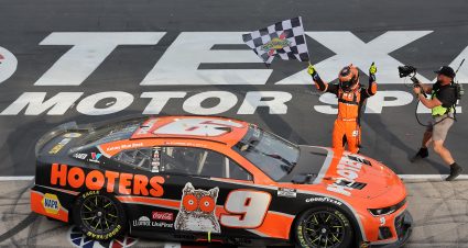 FORT WORTH, TEXAS - APRIL 14: Chase Elliott, driver of the #9 Hooters Chevrolet, celebrates with the checkered flag after winning the NASCAR Cup Series AutoTrader EchoPark Automotive 400 at Texas Motor Speedway on April 14, 2024 in Fort Worth, Texas. (Photo by Jonathan Bachman/Getty Images) | Getty Images