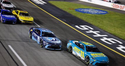 RICHMOND, VIRGINIA - MARCH 31: Denny Hamlin, driver of the #11 Mavis Tires & Brakes Toyota, leads Martin Truex Jr., driver of the #19 Auto-Owners Insurance Toyota, on the restart to win the NASCAR Cup Series Toyota Owners 400 at Richmond Raceway on March 31, 2024 in Richmond, Virginia. (Photo by Alex Slitz/Getty Images) | Getty Images