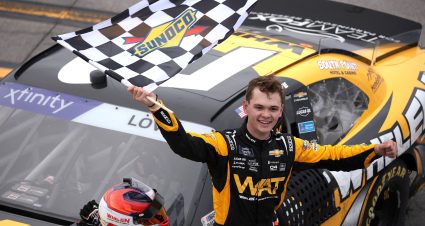 TALLADEGA, ALABAMA - APRIL 20: Jesse Love, driver of the #2 WAT Chevrolet, celebrates with the checkered flag after winning the NASCAR Xfinity Series Ag-Pro 300 at Talladega Superspeedway on April 20, 2024 in Talladega, Alabama. (Photo by James Gilbert/Getty Images) | Getty Images