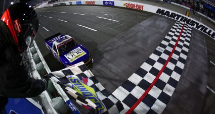 MARTINSVILLE, VIRGINIA - APRIL 05: Christian Eckes, driver of the #19 Adaptive One Calipers Chevrolet, takes the checkered flag to win the NASCAR Craftsman Long John Silver's 200 at Martinsville Speedway on April 05, 2024 in Martinsville, Virginia. (Photo by Jared C. Tilton/Getty Images) | Getty Images