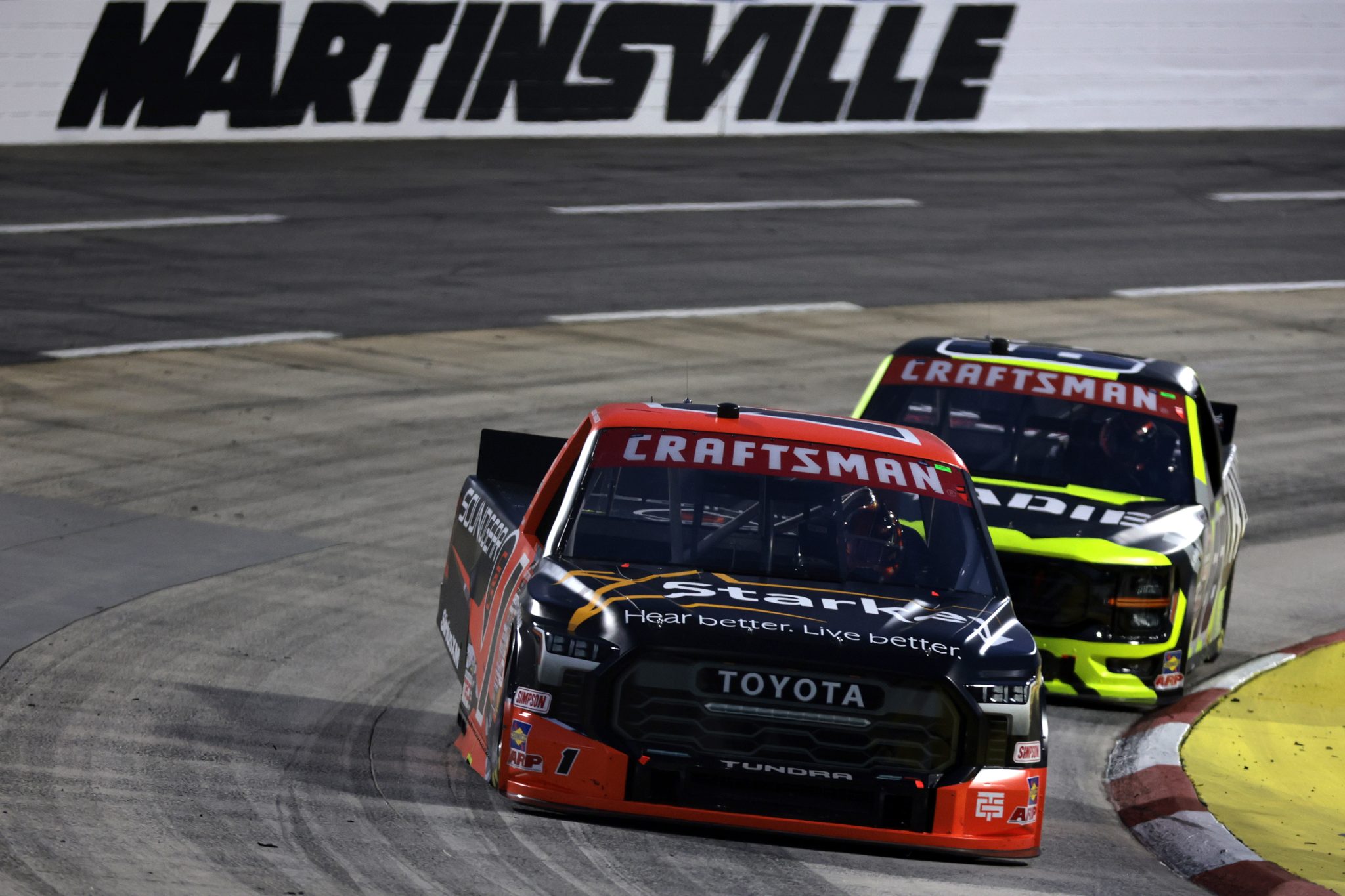MARTINSVILLE, VIRGINIA - APRIL 05: William Sawalich, driver of the #1 Starkey/Soundgear Toyota, and Cam Waters, driver of the #66 Tradie Ford, race during the NASCAR Craftsman Long John Silver's 200 at Martinsville Speedway on April 05, 2024 in Martinsville, Virginia. (Photo by James Gilbert/Getty Images) | Getty Images