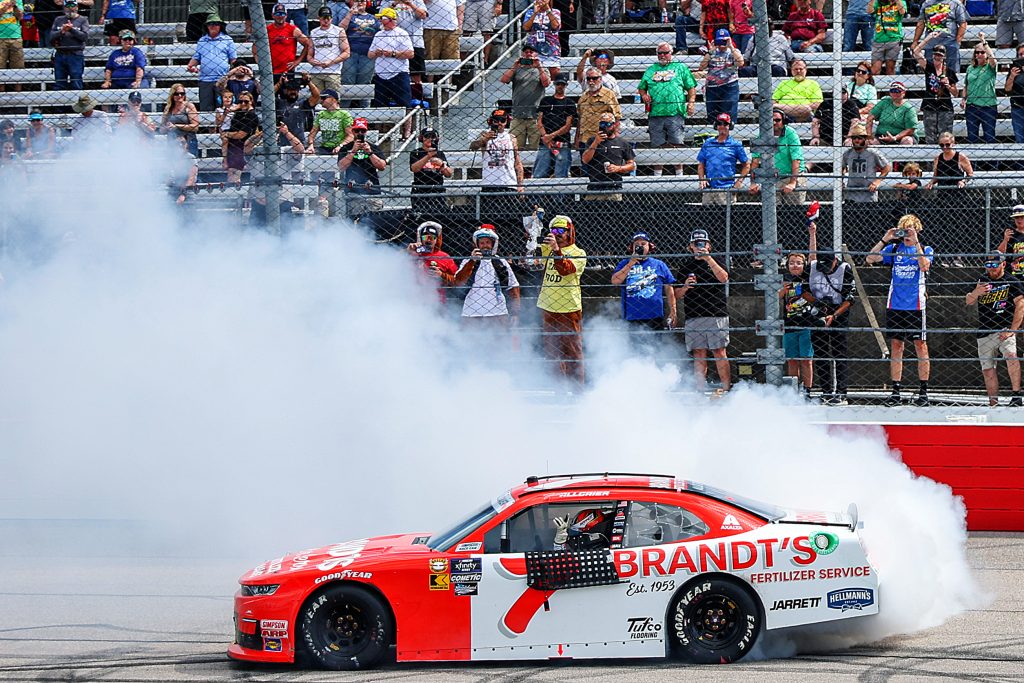 DARLINGTON, SOUTH CAROLINA - MAY 11: Justin Allgaier, driver of the #7 BRANDT Heritage Chevrolet, celebrates with a burnout after winning the NASCAR Xfinity Series Crown Royal Purple Bag Project 200 at Darlington Raceway on May 11, 2024 in Darlington, South Carolina. (Photo by Meg Oliphant/Getty Images) | Getty Images