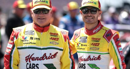 DARLINGTON, SOUTH CAROLINA - MAY 12: Kyle Larson, driver of the #5 HendrickCars.com Throwback Chevrolet, (R) and NASCAR Hall of Famer Terry Labonte pose for photos on the grid prior to the NASCAR Cup Series Goodyear 400 at Darlington Raceway on May 12, 2024 in Darlington, South Carolina. (Photo by James Gilbert/Getty Images) | Getty Images