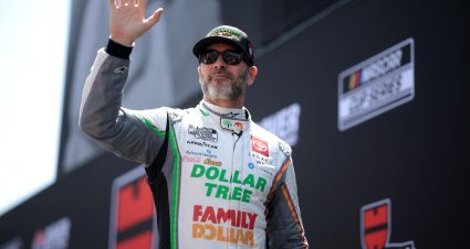 DOVER, DELAWARE - APRIL 28: Jimmie Johnson, driver of the #84 Dollar Tree/Family Dollar Toyota, waves to fans as he walks onstage during driver intros prior to the NASCAR Cup Series Würth 400 at Dover International Speedway on April 28, 2024 in Dover, Delaware. (Photo by James Gilbert/Getty Images) | Getty Images