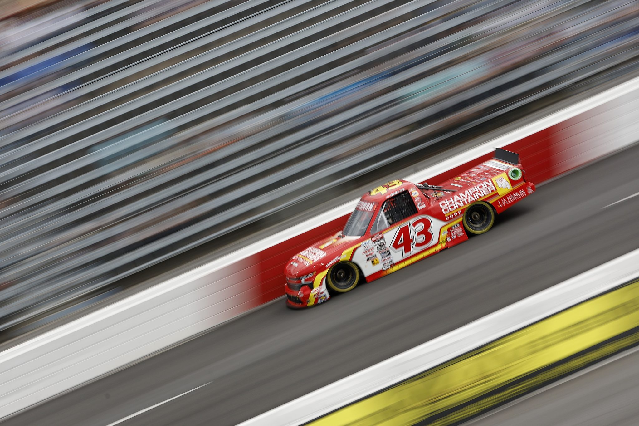 NORTH WILKESBORO, NORTH CAROLINA - MAY 17: Daniel Dye, driver of the #43 Champion Container Chevrolet, drives during practice for the NASCAR Craftsman Truck Series Wright Brand 250 at North Wilkesboro Speedway on May 17, 2024 in North Wilkesboro, North Carolina. (Photo by Sean Gardner/Getty Images) | Getty Images