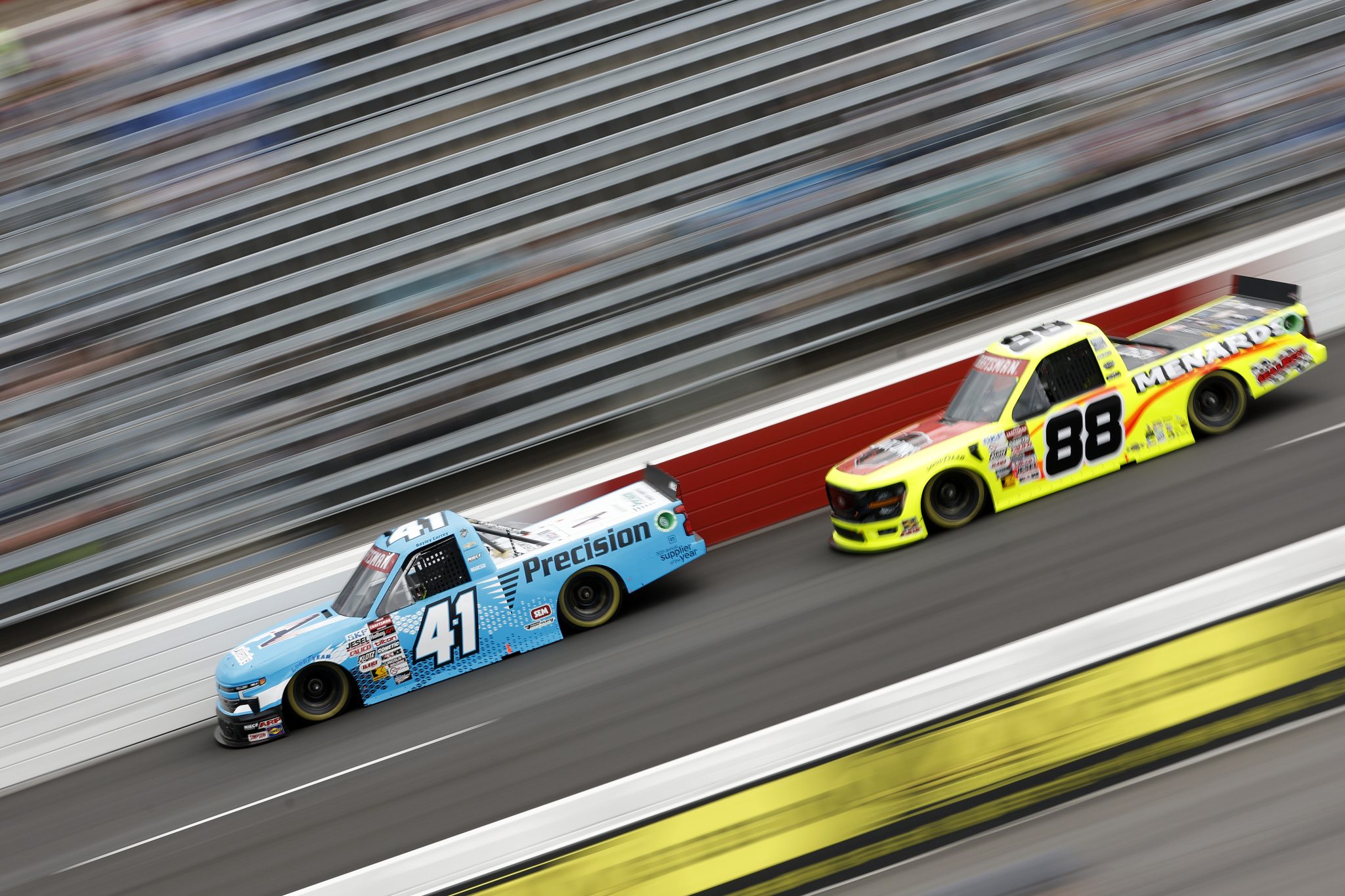 NORTH WILKESBORO, NORTH CAROLINA - MAY 17: Bayley Currey, driver of the #41 AutoVentive/Precision Chevrolet, and Matt Crafton, driver of the #88 Jack Links/Menards Ford, drive during practice for the NASCAR Craftsman Truck Series Wright Brand 250 at North Wilkesboro Speedway on May 17, 2024 in North Wilkesboro, North Carolina. (Photo by Sean Gardner/Getty Images) | Getty Images