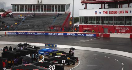 NORTH WILKESBORO, NORTH CAROLINA - MAY 17: A general view of cars covered and parked on the grid during a weather delay in qualifying for the NASCAR Cup Series All-Star Open at North Wilkesboro Speedway on May 17, 2024 in North Wilkesboro, North Carolina. (Photo by Jared C. Tilton/Getty Images) | Getty Images