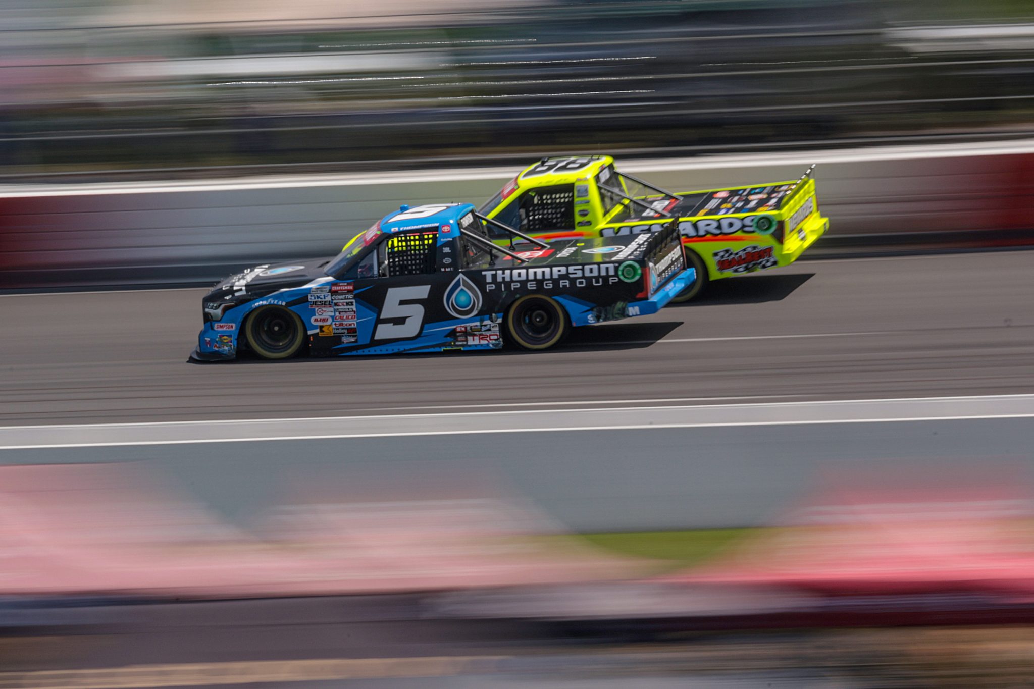 NORTH WILKESBORO, NORTH CAROLINA - MAY 19: Dean Thompson, driver of the #5 Thompson Pipe Group Toyota, and Matt Crafton, driver of the #88 Jack Links/Menards Ford, race during the NASCAR Craftsman Truck Series Wright Brand 250 at North Wilkesboro Speedway on May 19, 2024 in North Wilkesboro, North Carolina. (Photo by James Gilbert/Getty Images) | Getty Images