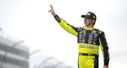 DOVER, DELAWARE - APRIL 27: Brandon Jones, driver of the #9 Menards/Barracuda Chevrolet, waves to fans as he walks onstage during driver intros prior to the NASCAR Xfinity Series BetRivers 200 at Dover International Speedway on April 27, 2024 in Dover, Delaware. (Photo by James Gilbert/Getty Images) | Getty Images