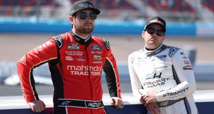 AVONDALE, ARIZONA - MARCH 09: Chase Briscoe, driver of the #14 Mahindra Tractors Ford, (L) and Noah Gragson, driver of the #10 SERVPRO Ford, wait on the grid during qualifying for the NASCAR Cup Series Shriners Children's 500 at Phoenix Raceway on March 09, 2024 in Avondale, Arizona. (Photo by Meg Oliphant/Getty Images) | Getty Images