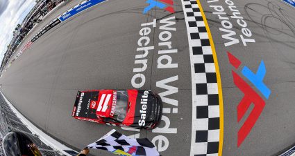 MADISON, ILLINOIS - JUNE 01: Corey Heim, driver of the #11 Safelite Toyota, takes the checkered flag to win the NASCAR Craftsman Truck Series Toyota 200 at WWT Raceway on June 01, 2024 in Madison, Illinois. (Photo by Logan Riely/Getty Images) | Getty Images