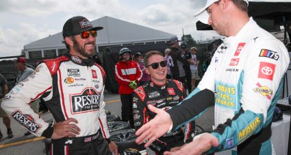 LOUDON, NEW HAMPSHIRE - JULY 15: (L-R) Martin Truex Jr., driver of the #19 Reser's Fine Foods Toyota, Christopher Bell, driver of the #20 Rheem/WATTS Toyota, and Denny Hamlin, driver of the #11 Mavis Tires & Brakes Toyota, talk on the grid during practice for the NASCAR Cup Series Crayon 301 at New Hampshire Motor Speedway on July 15, 2023 in Loudon, New Hampshire. (Photo by Jonathan Bachman/Getty Images) | Getty Images