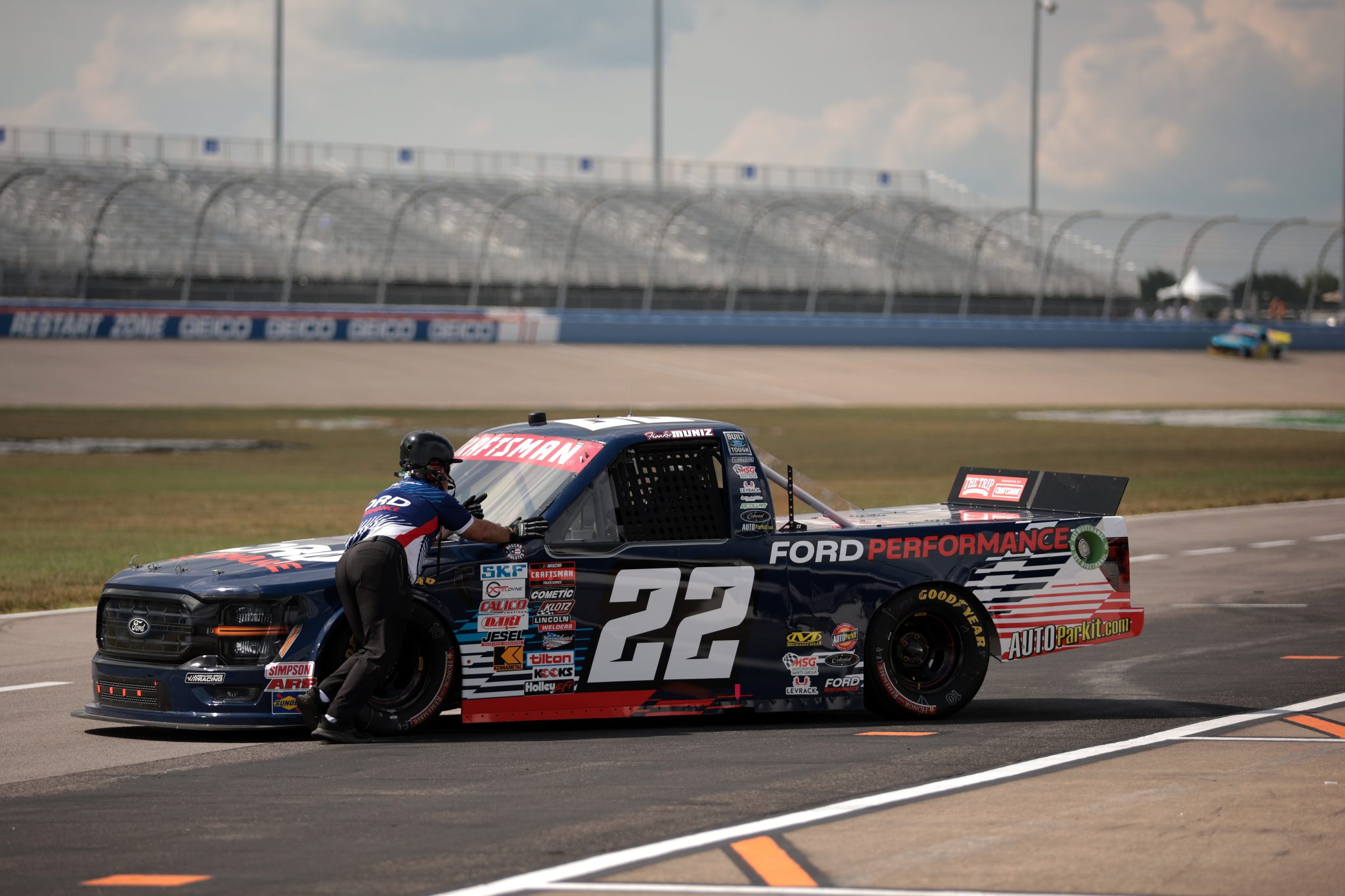 LEBANON, TENNESSEE - JUNE 28: A crew member pushes the #22 Ford Performance Ford, driven by Frankie Muniz during practice for the NASCAR Craftsman Truck Series Rackley Roofing 200 at Nashville Superspeedway on June 28, 2024 in Lebanon, Tennessee. (Photo by James Gilbert/Getty Images) | Getty Images