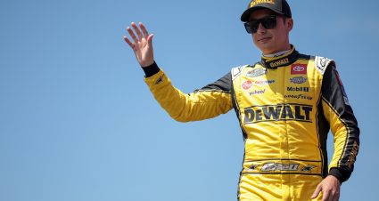 LEBANON, TENNESSEE - JUNE 30: Christopher Bell, driver of the #20 DEWALT Concrete Solutions Toyota, waves to fans as he walks onstage during driver intros prior to the NASCAR Cup Series Ally 400 at Nashville Superspeedway on June 30, 2024 in Lebanon, Tennessee. (Photo by James Gilbert/Getty Images) | Getty Images