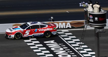 SONOMA, CALIFORNIA - JUNE 09: Kyle Larson, driver of the #5 Valvoline Chevrolet, takes the checkered flag to win the NASCAR Cup Series Toyota/Save Mart 350 at Sonoma Raceway on June 09, 2024 in Sonoma, California. (Photo by Meg Oliphant/Getty Images) | Getty Images