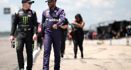 LONG POND, PENNSYLVANIA - JULY 13: Ty Gibbs, driver of the #54 Monster Energy Toyota, (L) and Bubba Wallace, driver of the #23 Leidos Toyota, talk on the grid during qualifying for the NASCAR Cup Series The Great American Getaway 400 at Pocono Raceway on July 13, 2024 in Long Pond, Pennsylvania. (Photo by James Gilbert/Getty Images) | Getty Images