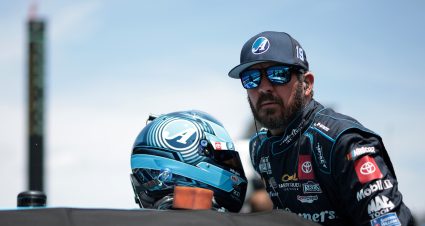 INDIANAPOLIS, INDIANA - JULY 20: Martin Truex Jr., driver of the #19 Auto-Owners Insurance Toyota, enters his car. during qualifying for the NASCAR Cup Series Brickyard 400 at Indianapolis Motor Speedway on July 20, 2024 in Indianapolis, Indiana. (Photo by James Gilbert/Getty Images) | Getty Images