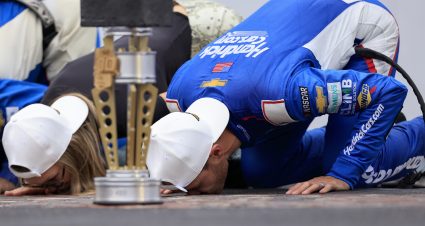 INDIANAPOLIS, INDIANA - JULY 21: Kyle Larson, driver of the #5 HendrickCars.com Chevrolet, kisses the yard of bricks after winning the NASCAR Cup Series Brickyard 400 at Indianapolis Motor Speedway on July 21, 2024 in Indianapolis, Indiana. (Photo by Justin Casterline/Getty Images) | Getty Images