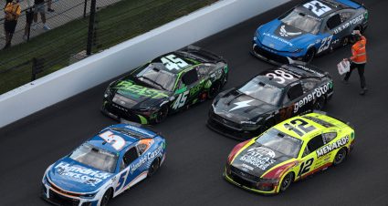 INDIANAPOLIS, INDIANA - JULY 21:  Kyle Larson, driver of the #5 HendrickCars.com Chevrolet, Tyler Reddick, driver of the #45 The Beast Unleashed Toyota, Ryan Blaney, driver of the #12 Menards/Atlas Ford, Todd Gilliland, driver of the #38 gener8tor Ford, and Bubba Wallace, driver of the #23 U.S. Air Force Toyota, sit parked on the track under caution during the NASCAR Cup Series Brickyard 400 at Indianapolis Motor Speedway on July 21, 2024 in Indianapolis, Indiana. (Photo by James Gilbert/Getty Images) | Getty Images