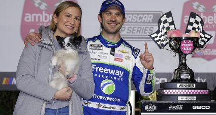 HAMPTON, GEORGIA - FEBRUARY 25: Daniel Suarez, driver of the #99 Freeway Insurance Chevrolet, celebrates with Julia Piquet  in victory lane after winning the NASCAR Cup Series Ambetter Health 400 at Atlanta Motor Speedway on February 25, 2024 in Hampton, Georgia. (Photo by Todd Kirkland/Getty Images) | Getty Images