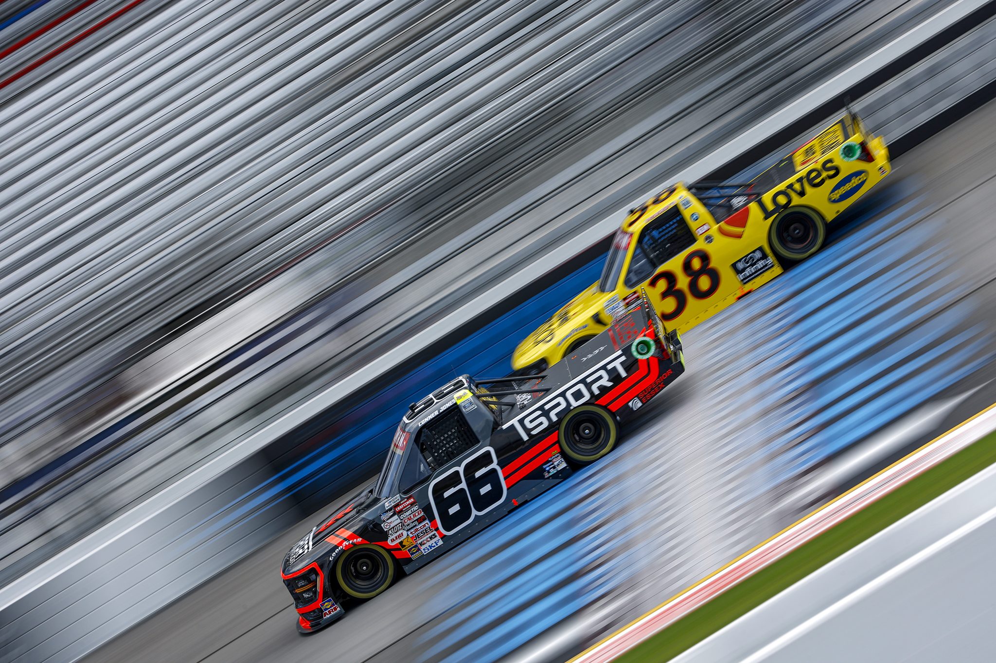RICHMOND, VIRGINIA - AUGUST 10: Conner Jones, driver of the #66 TSPORT Ford, and Layne Riggs, driver of the #38 Love's RV Stops Ford, drive during practice for the NASCAR Craftsman Truck Series Clean Harbors 250 at Richmond Raceway on August 10, 2024 in Richmond, Virginia. (Photo by Sean Gardner/Getty Images) | Getty Images
