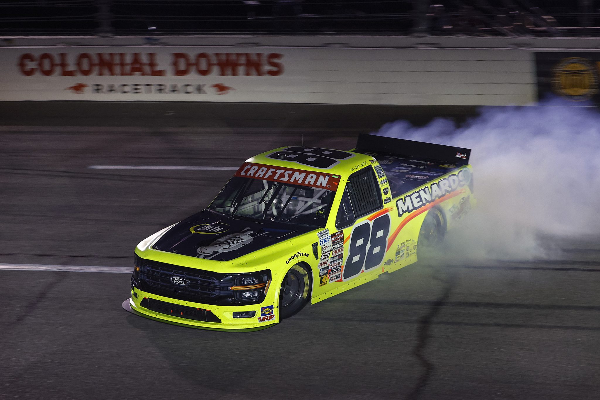 RICHMOND, VIRGINIA - AUGUST 10: Matt Crafton, driver of the #88 Serta/Menards Ford, spins after an on-track incident during the NASCAR Craftsman Truck Series Clean Harbors 250 at Richmond Raceway on August 10, 2024 in Richmond, Virginia. (Photo by Sean Gardner/Getty Images) | Getty Images