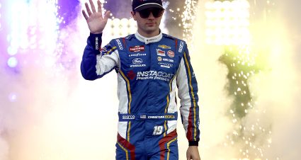 RICHMOND, VIRGINIA - AUGUST 10: Christian Eckes, driver of the #19 Instacoat Premium Products Chevrolet, waves to fans as he walks onstage during driver intros prior to the NASCAR Craftsman Truck Series Clean Harbors 250 at Richmond Raceway on August 10, 2024 in Richmond, Virginia. (Photo by Sean Gardner/Getty Images) | Getty Images