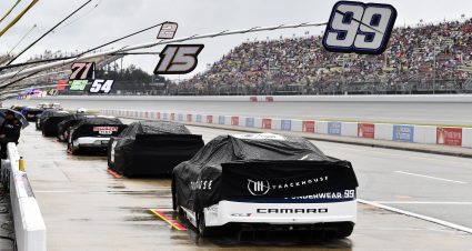 BROOKLYN, MICHIGAN - AUGUST 18: A general view of cars parked and covered during a weather delay prior to the NASCAR Cup Series FireKeepers Casino 400 at Michigan International Speedway on August 18, 2024 in Brooklyn, Michigan. (Photo by Logan Riely/Getty Images) | Getty Images