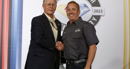 DARLINGTON, SOUTH CAROLINA - MAY 14: NASCAR Chairman and CEO Jim France (L) congratulates former NASCAR Series Cup driver Greg Biffle on selection to NASCAR's 75 Greatest Drivers list prior to the NASCAR Cup Series Goodyear 400 at Darlington Raceway on May 14, 2023 in Darlington, South Carolina. (Photo by Jared C. Tilton/Getty Images) | Getty Images