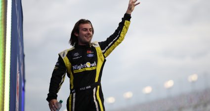 DAYTONA BEACH, FLORIDA - AUGUST 23: Kyle Sieg, driver of the #28 North Country Ford Ford, waves to fans as he walks onstage during driver intros prior to  the NASCAR Xfinity Series Wawa 250 Powered by Coca-Cola at Daytona International Speedway on August 23, 2024 in Daytona Beach, Florida. (Photo by James Gilbert/Getty Images) | Getty Images