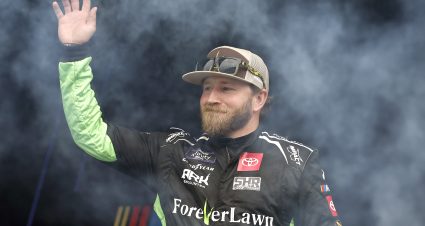 TALLADEGA, ALABAMA - APRIL 20: Jeffrey Earnhardt, driver of the #26 ForeverLawn Toyota, waves to fans as he walks onstage during driver intros prior to the NASCAR Xfinity Series Ag-Pro 300 at Talladega Superspeedway on April 20, 2024 in Talladega, Alabama. (Photo by Sean Gardner/Getty Images) | Getty Images