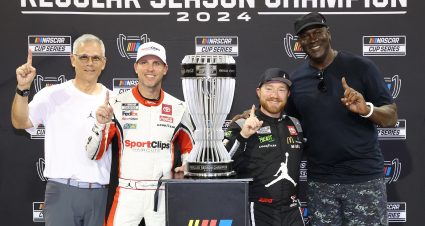 DARLINGTON, SOUTH CAROLINA - SEPTEMBER 01: 2024 Regular Season Champion, Tyler Reddick, driver of the #45 Upper Deck Toyota, poses with 23XI Racing co-owners NBA Hall of Famer, Michael Jordan and Denny Hamlin, driver of the #11 Sport Clips Haircuts Toyota, after the NASCAR Cup Series Cook Out Southern 500 at Darlington Raceway on September 01, 2024 in Darlington, South Carolina. (Photo by Meg Oliphant/Getty Images) | Getty Images