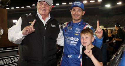 BRISTOL, TENNESSEE - SEPTEMBER 21: (L-R) NASCAR Hall of Famer and Hendrick Motorsport team owner, Rick Hendrick celebrates with Kyle Larson, driver of the #5 HendrickCars.com Chevrolet, and his son, Owen Larson in victory lane after winning the NASCAR Cup Series Bass Pro Shops Night Race at Bristol Motor Speedway on September 21, 2024 in Bristol, Tennessee. (Photo by James Gilbert/Getty Images) | Getty Images