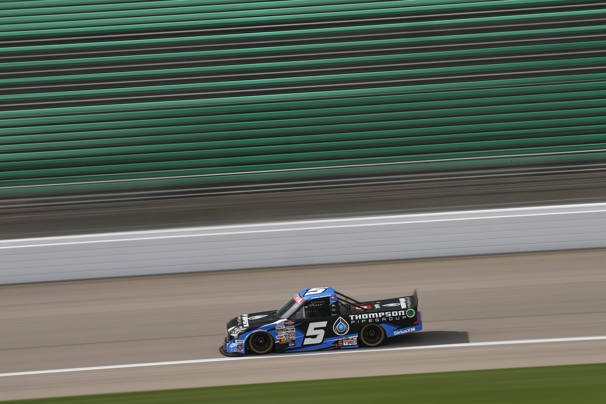 KANSAS CITY, KANSAS - SEPTEMBER 20: Dean Thompson, driver of the #5 Thompson Pipe Group Toyota, drives during practice for the NASCAR Craftsman Truck Series Kubota Tractor 200 at Kansas Speedway on September 20, 2024 in Kansas City, Kansas. (Photo by Chris Graythen/Getty Images) | Getty Images
